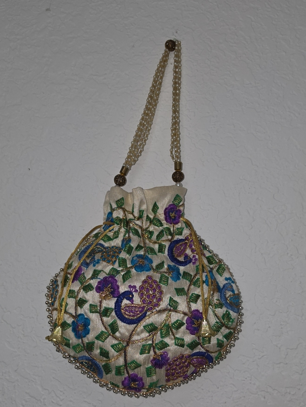 Embroidered Ivory Potli Bag with Purple & Blue Floral Peacock Motif